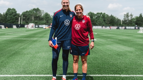 Casey Murphy (left) and Denise Reddy standing together side by side on the field 