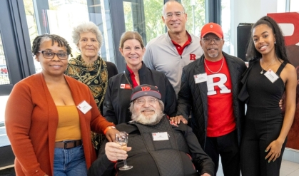 From left, Kendall Hall RC’88, Susan Robeson, Rutgers Foundation President Kimberly Hopely, Jim Savage RC’71 (seated), Rutgers President Jonathan Holloway, Alonzo Adams MGSA’84, and Rutgers student Jocelynn Hunter Dow. 