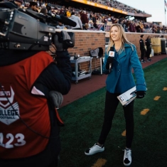 Sisler reporting on a college football sideline